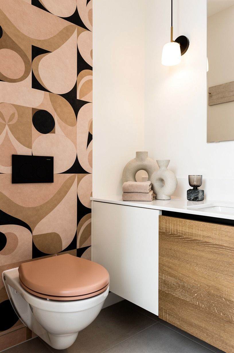I framed the toilet with playful wall art vs. nothing at all