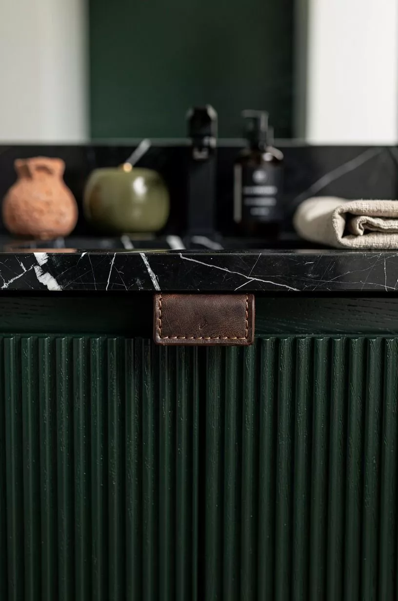 Add fluted black wood cabinet fronts