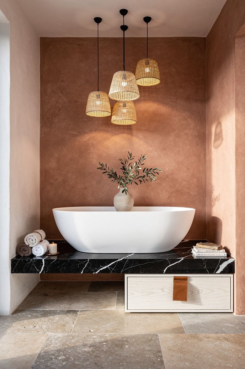 Hang woven pendants above a freestanding tub