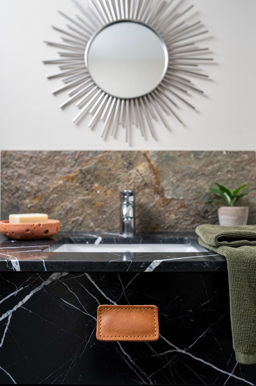 Hang a starburst mirror above the sink