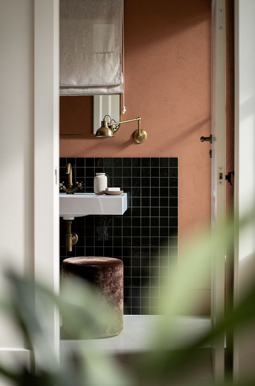Create a black tiled vanity backsplash