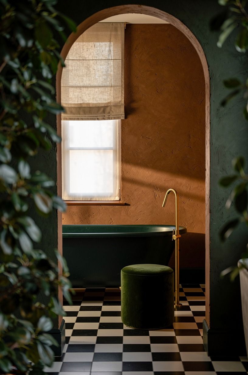 What does checkerboard tile do for a dark green bathroom?