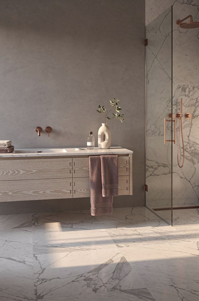 Run stone flooring into the shower seamlessly (The Continuous-Plane Move)