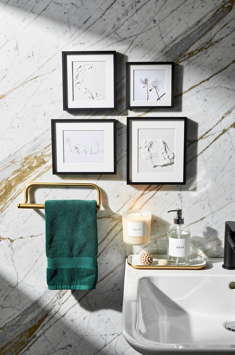 Finish with white art in black frames