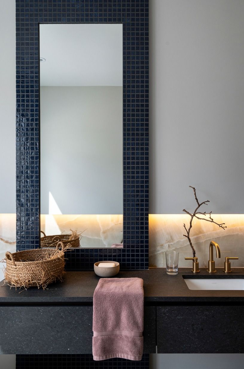 Use navy mosaic tile around the mirror