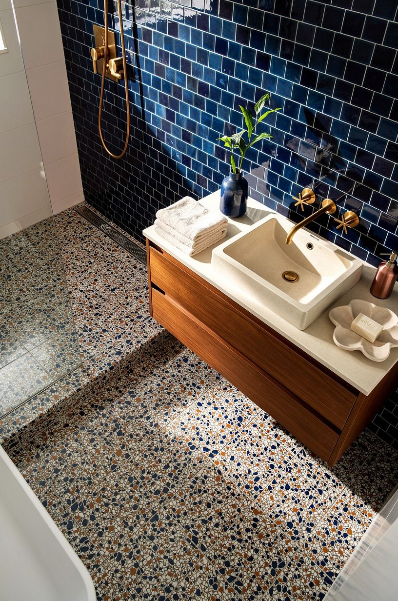 swap subway tile for oversized-chip terrazzo on the wet wall