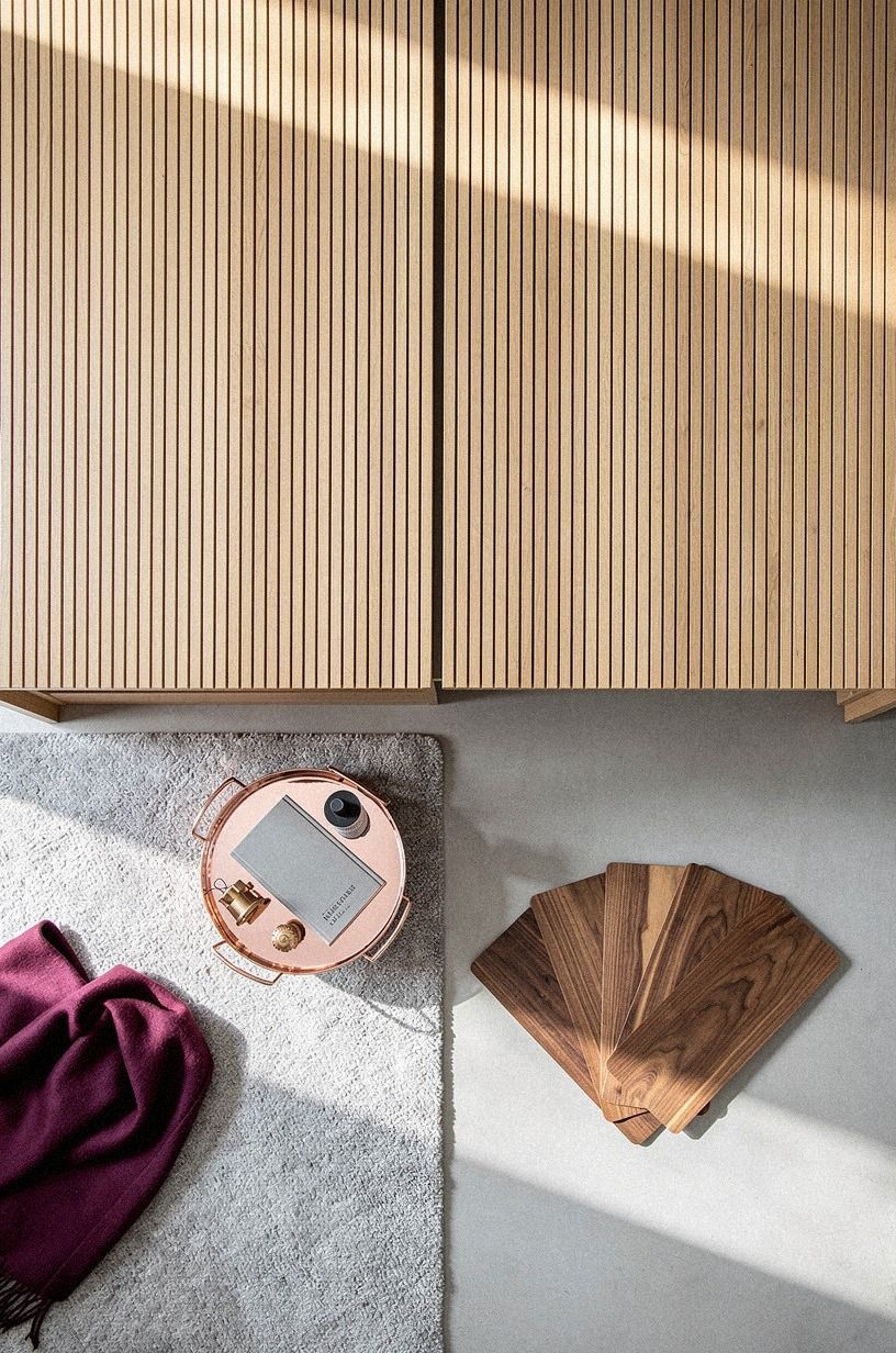 Layer slim battens across door seams