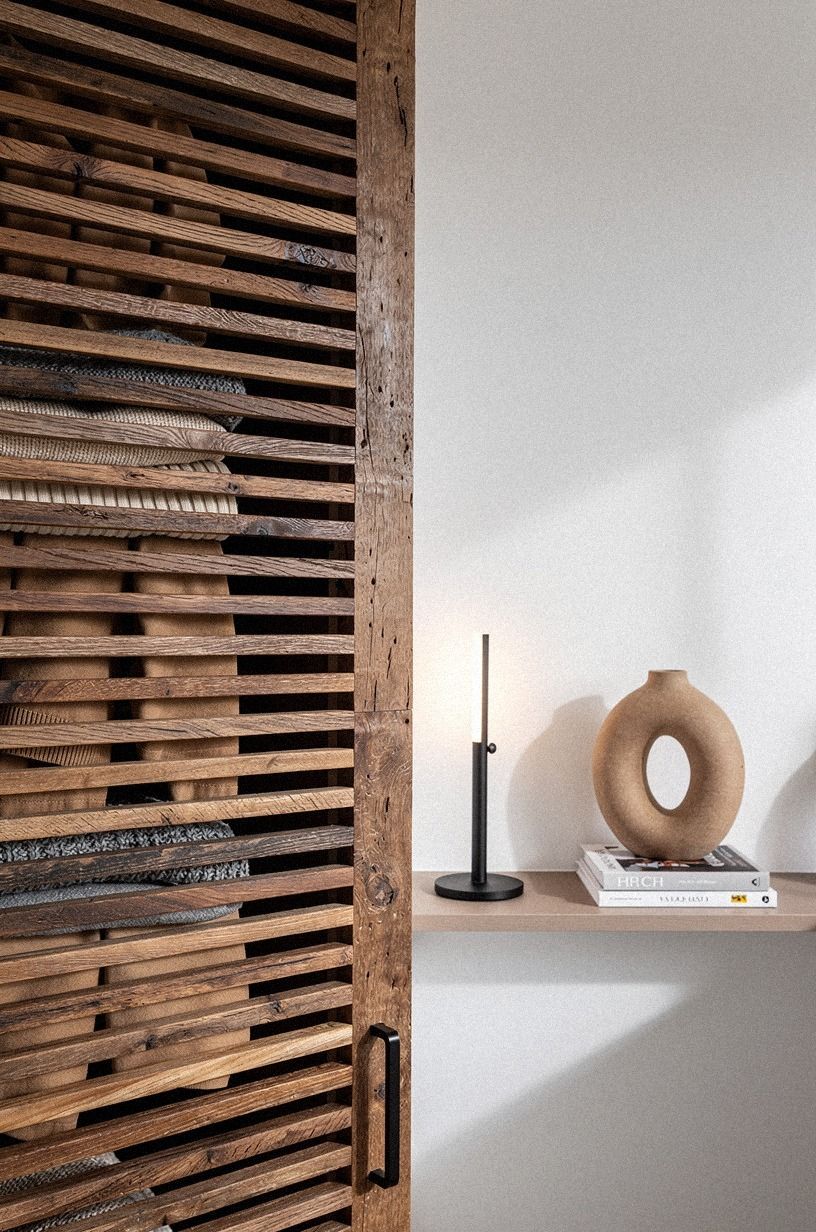 Use slatted panels to blur door seams