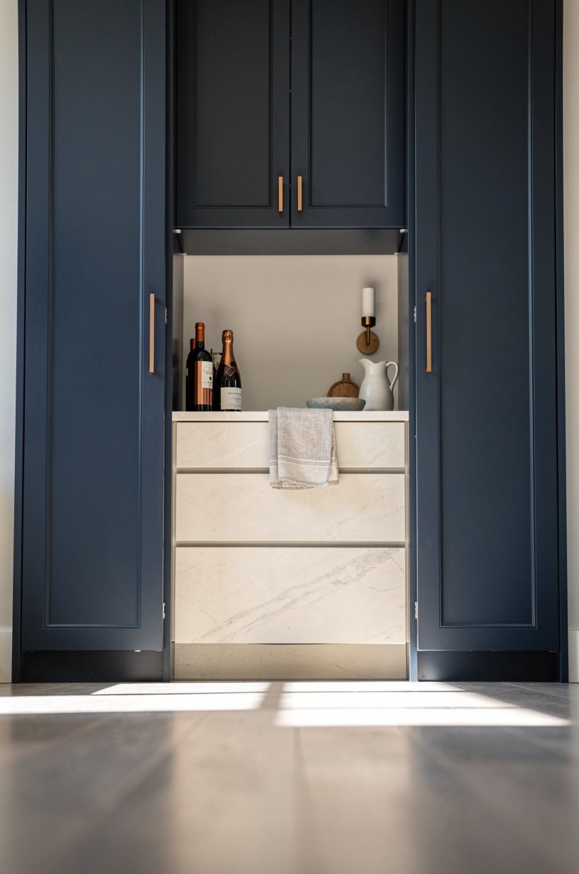 Frame the entrance with a floor-to-ceiling wine column