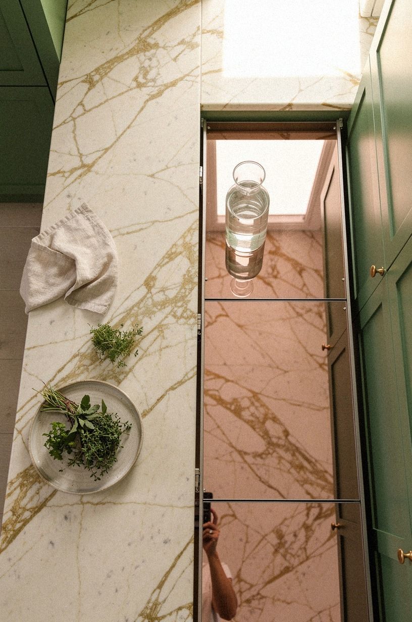 Use mirrored panels to hide the pantry