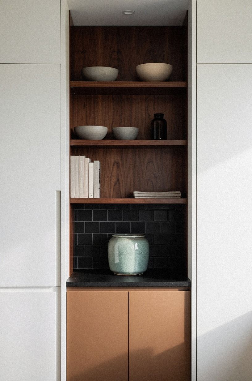 Line the detail pantry with moody tile