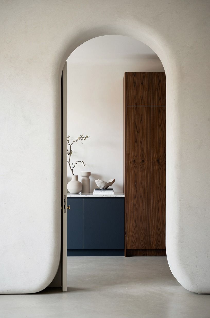 Frame the Door So It Reads as Wall, Not Cabinet