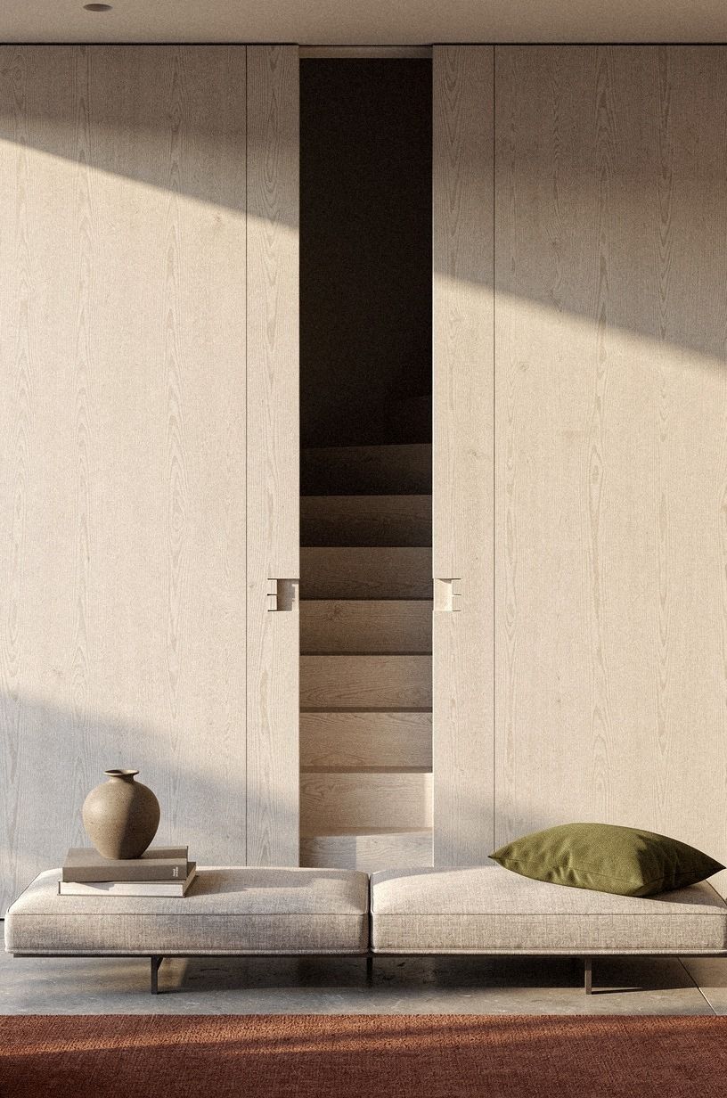 Camouflage the stair door with full-height paneling (The Quiet Wall Rule)