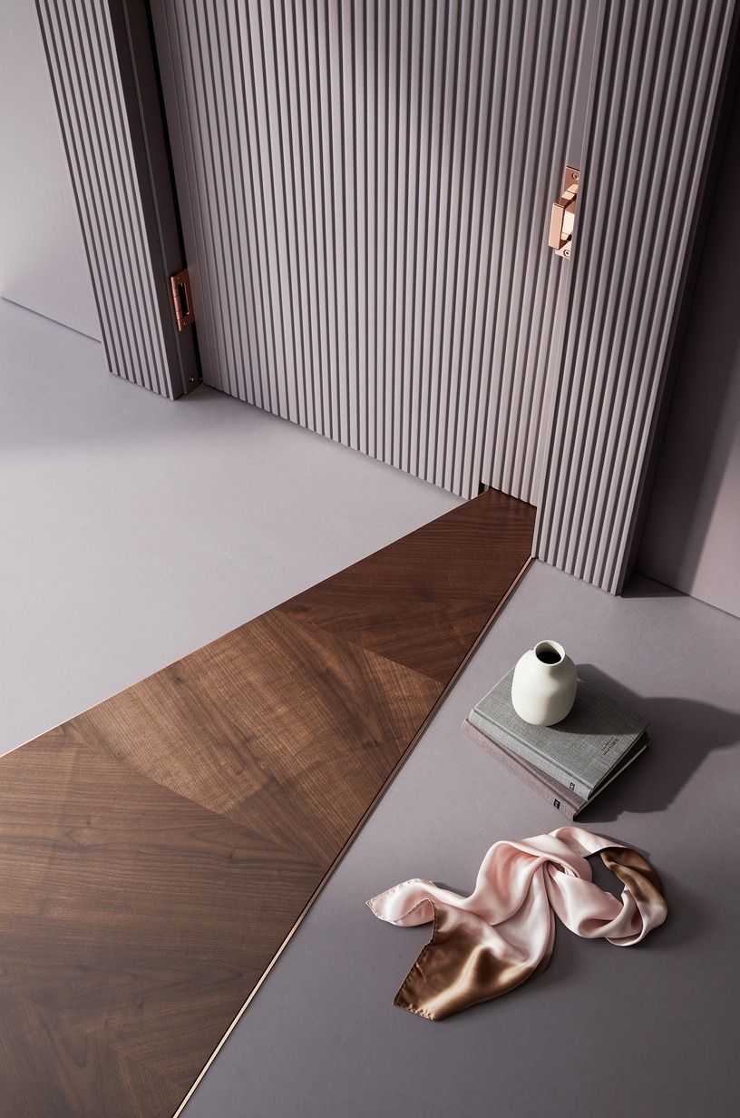 Frame the opening with matching fluted pilasters
