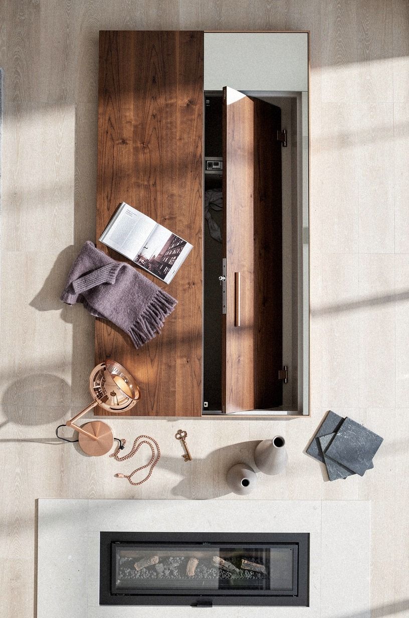 Mount a mirror portal beside the fireplace