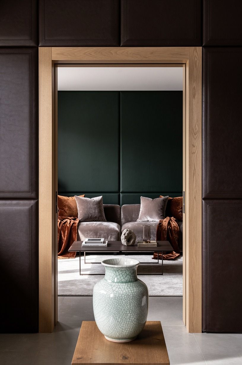 Clad the entry in leather wrapped wall panels