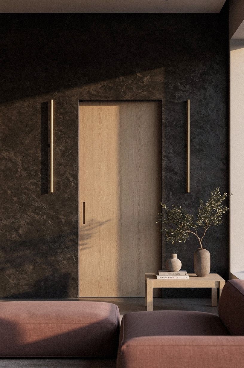 Frame the reveal with slim brass sconces