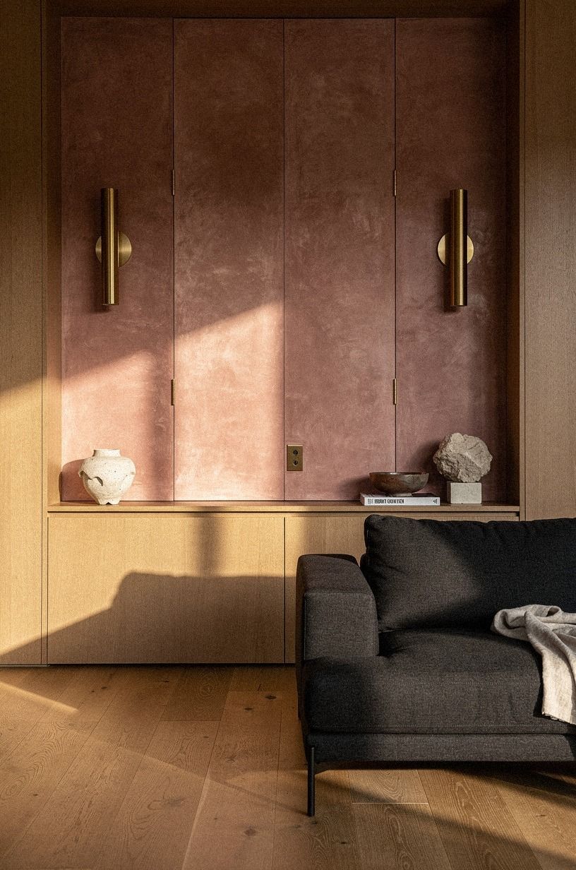Install touch-latch panels behind wall sconces