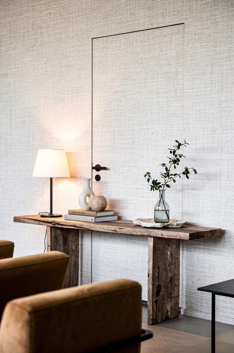 Blend the door behind grasscloth wallpaper