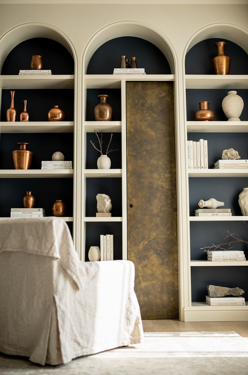 Use arched shelves for a softer reveal
