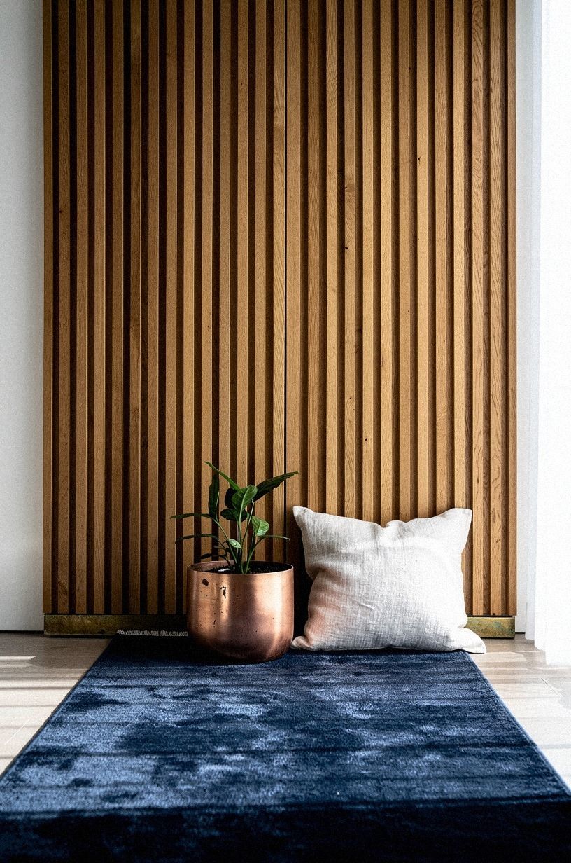 Frame the reveal with vertical oak slats (The Slat-Frame Architecture)