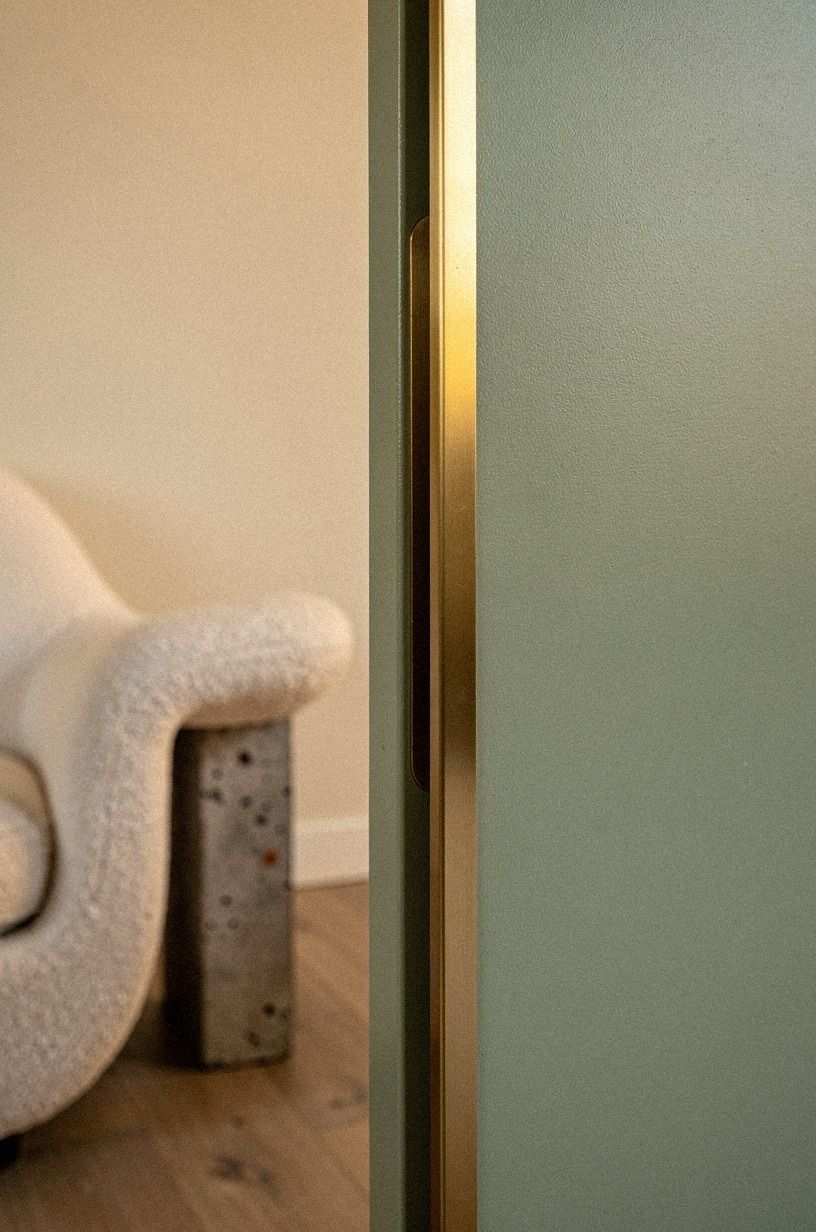 Conceal the handle inside a brass inlay