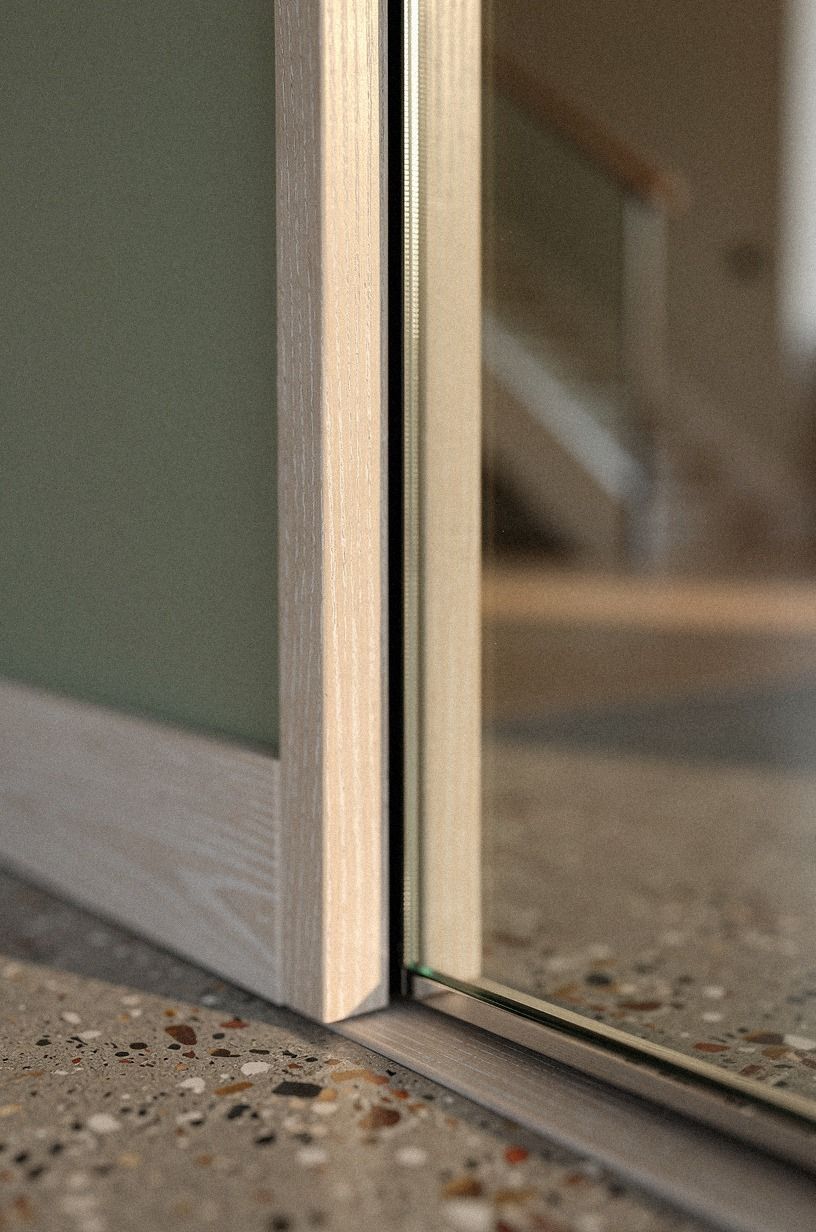Mirror the panel to widen the room (Reflection over interruption)