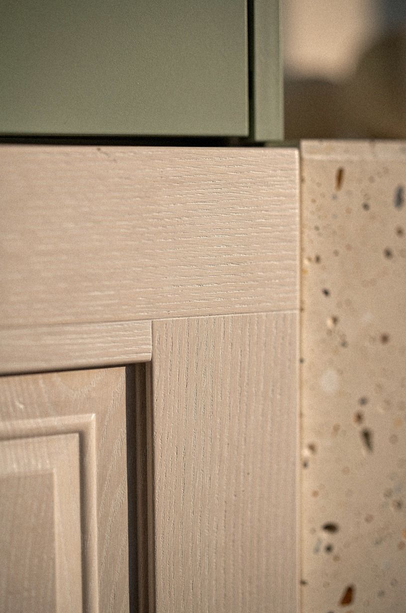 Run wainscoting straight across the door face