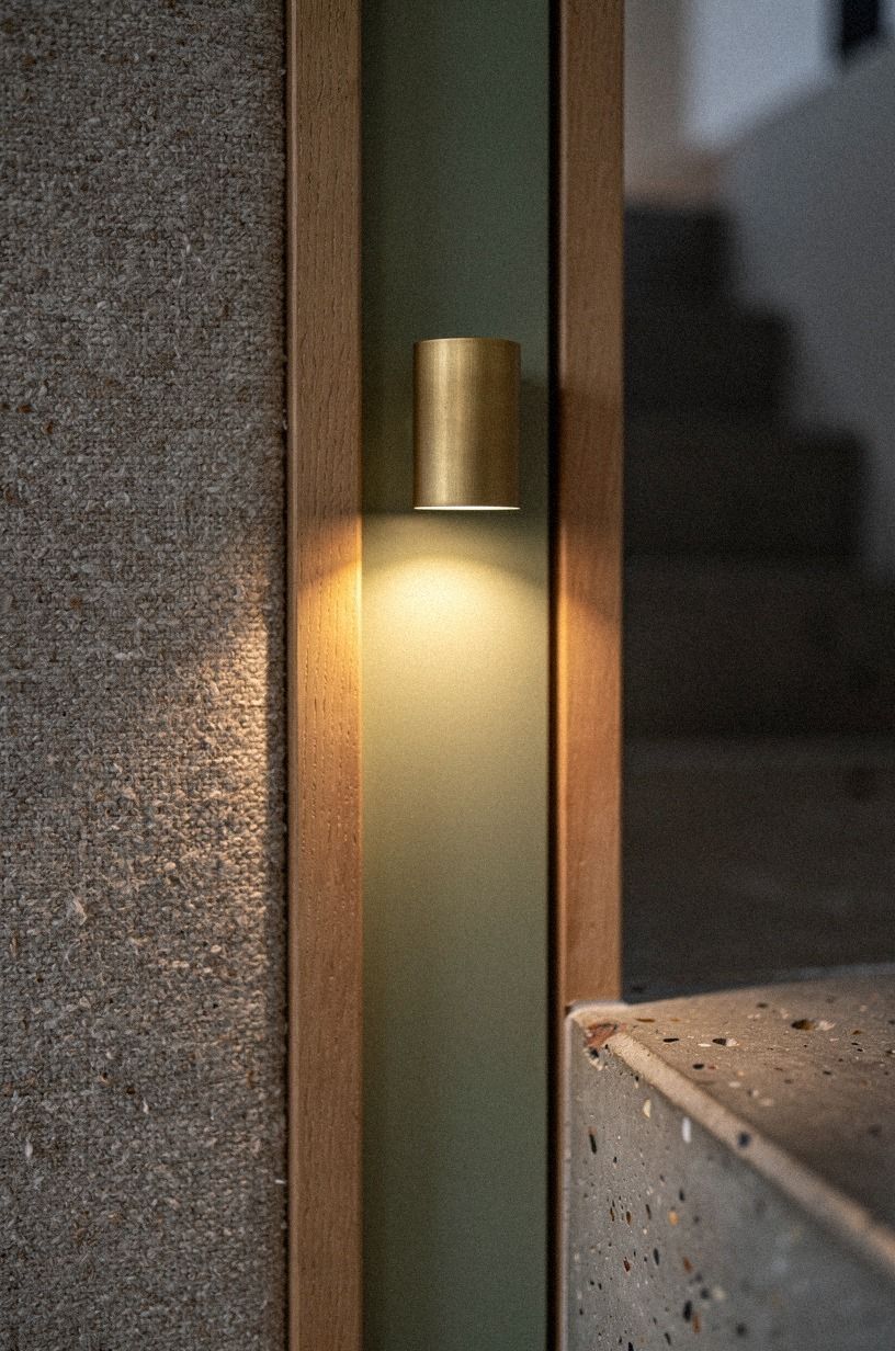 Light the detail threshold with brass sconces