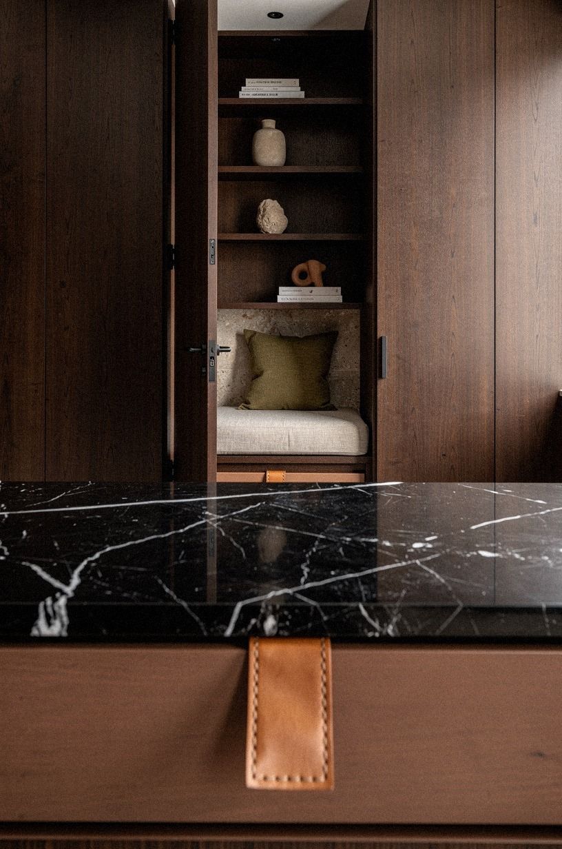 Tuck a lounge behind paneled built-ins