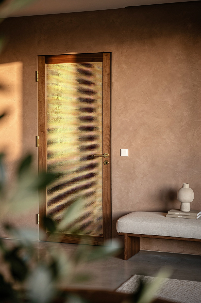 Conceal the basement door with cane panels
