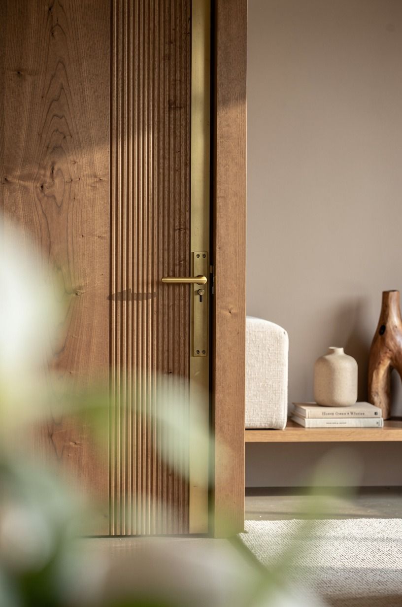 Pocket the door behind fluted oak cladding