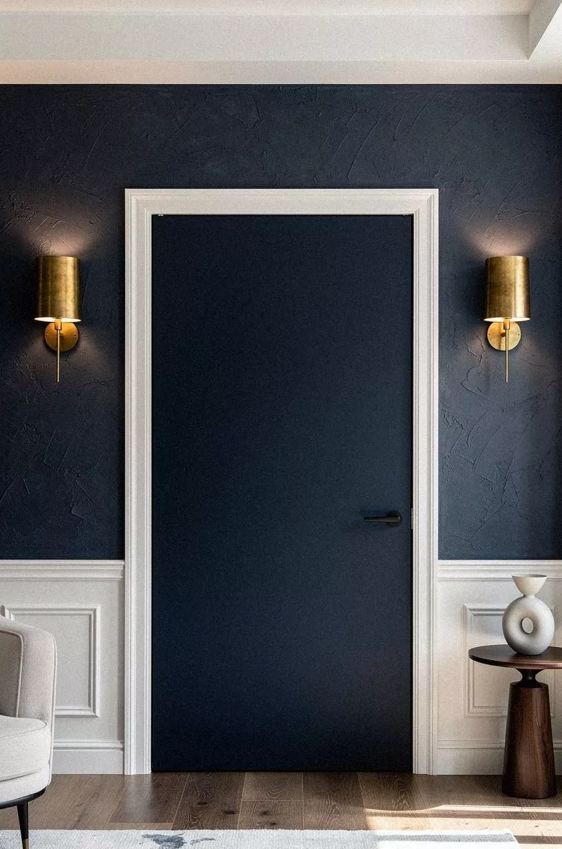 Soften the hidden door with sconces