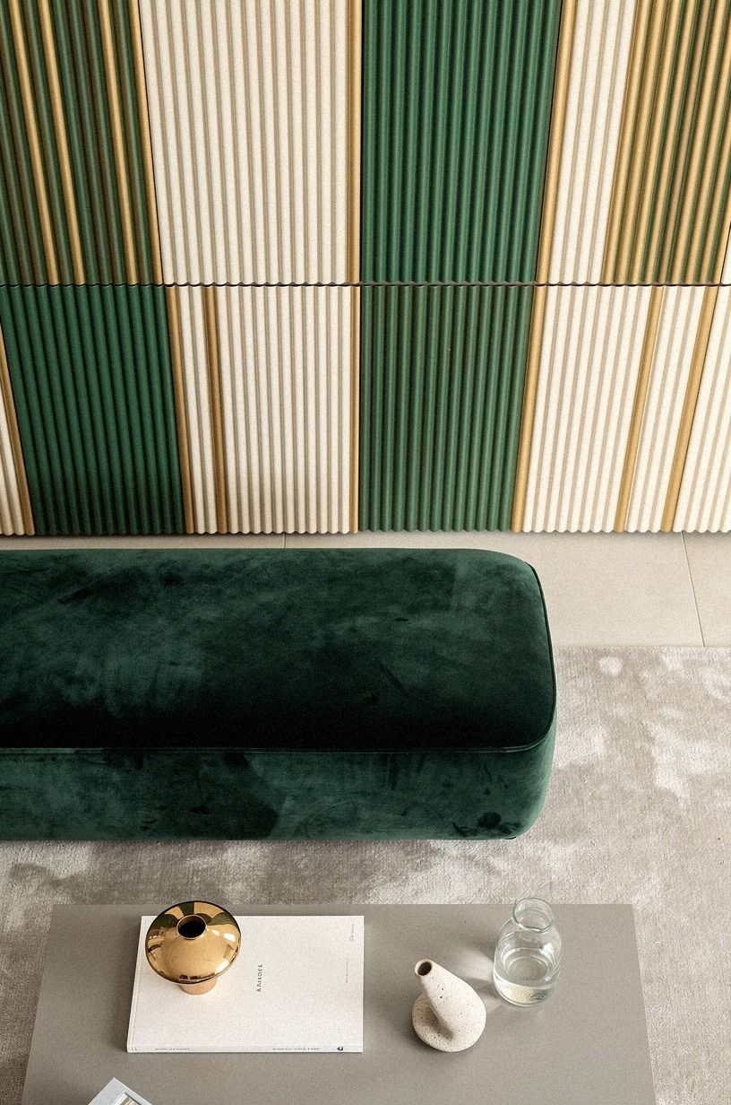 Run fluted cladding across the entire wall for one continuous surface