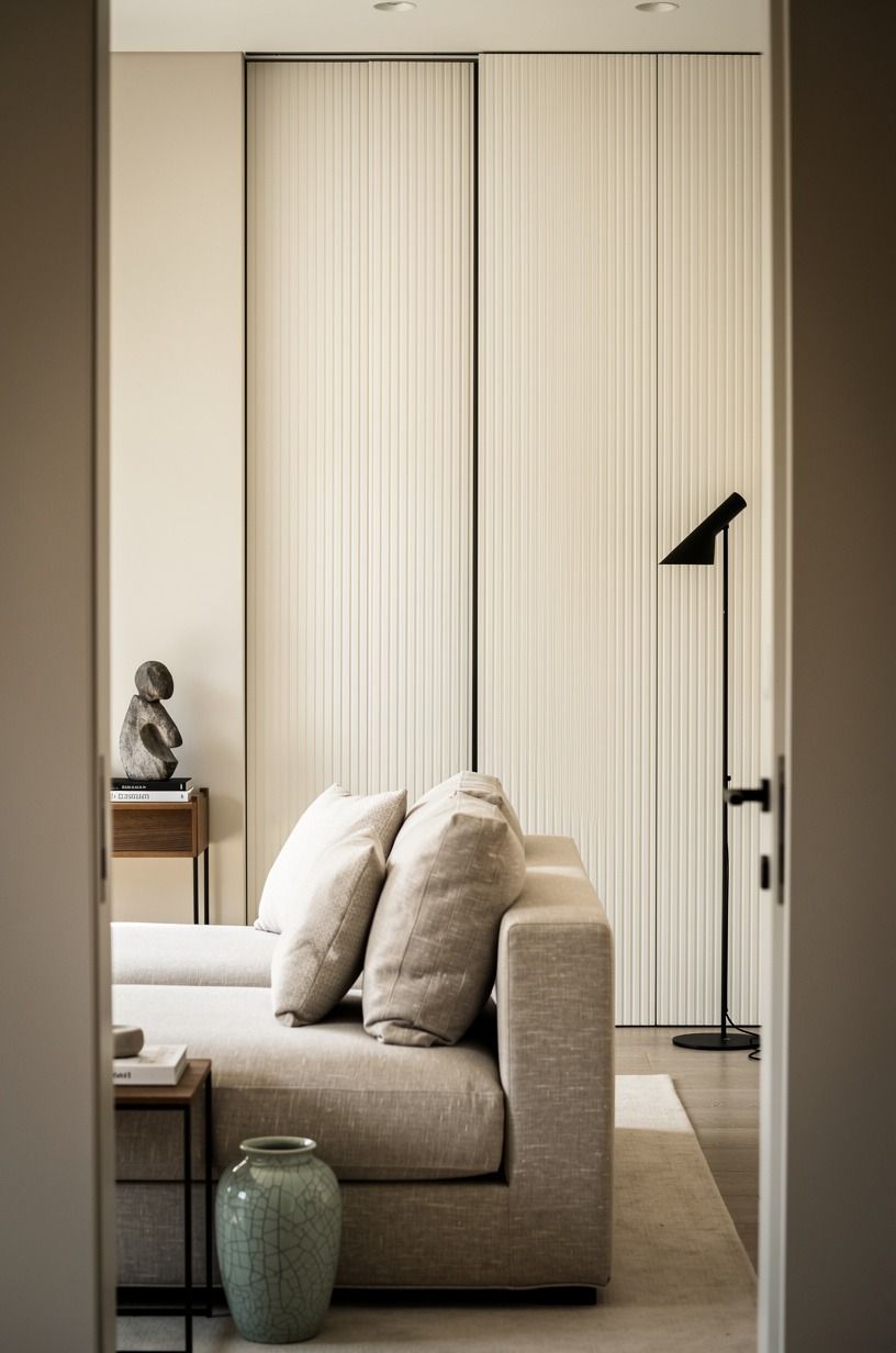 Bookmatch reeded panels across the hidden opening