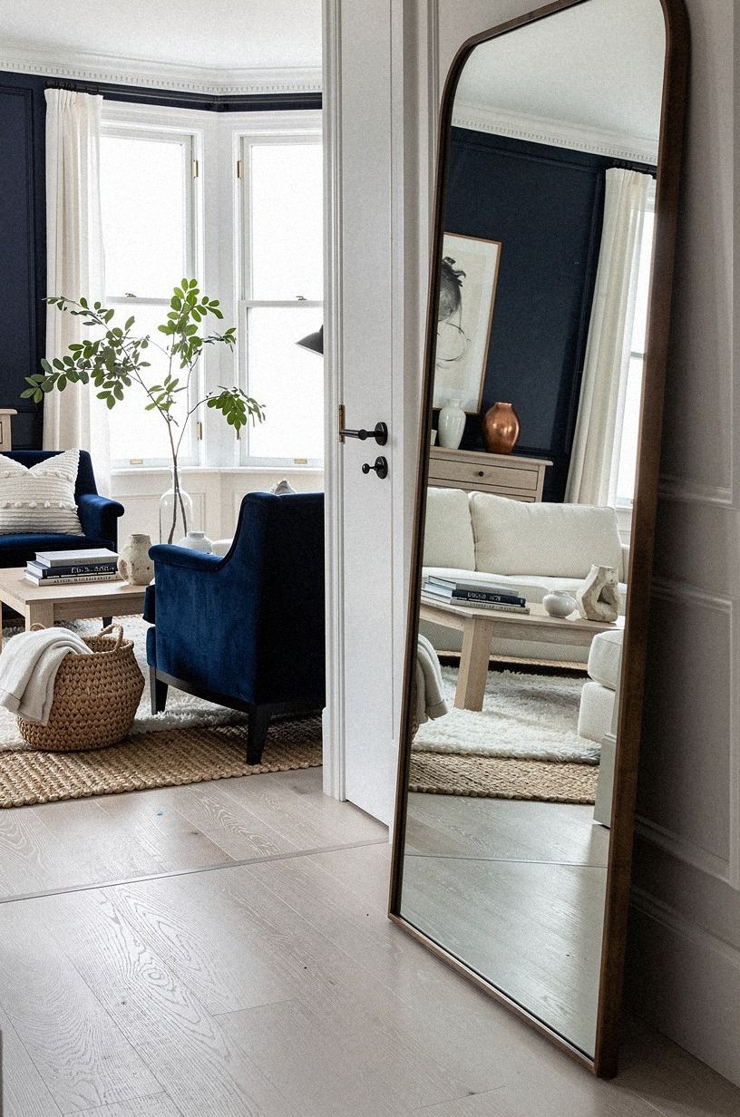 Hang a tall leaning mirror right in front of the door