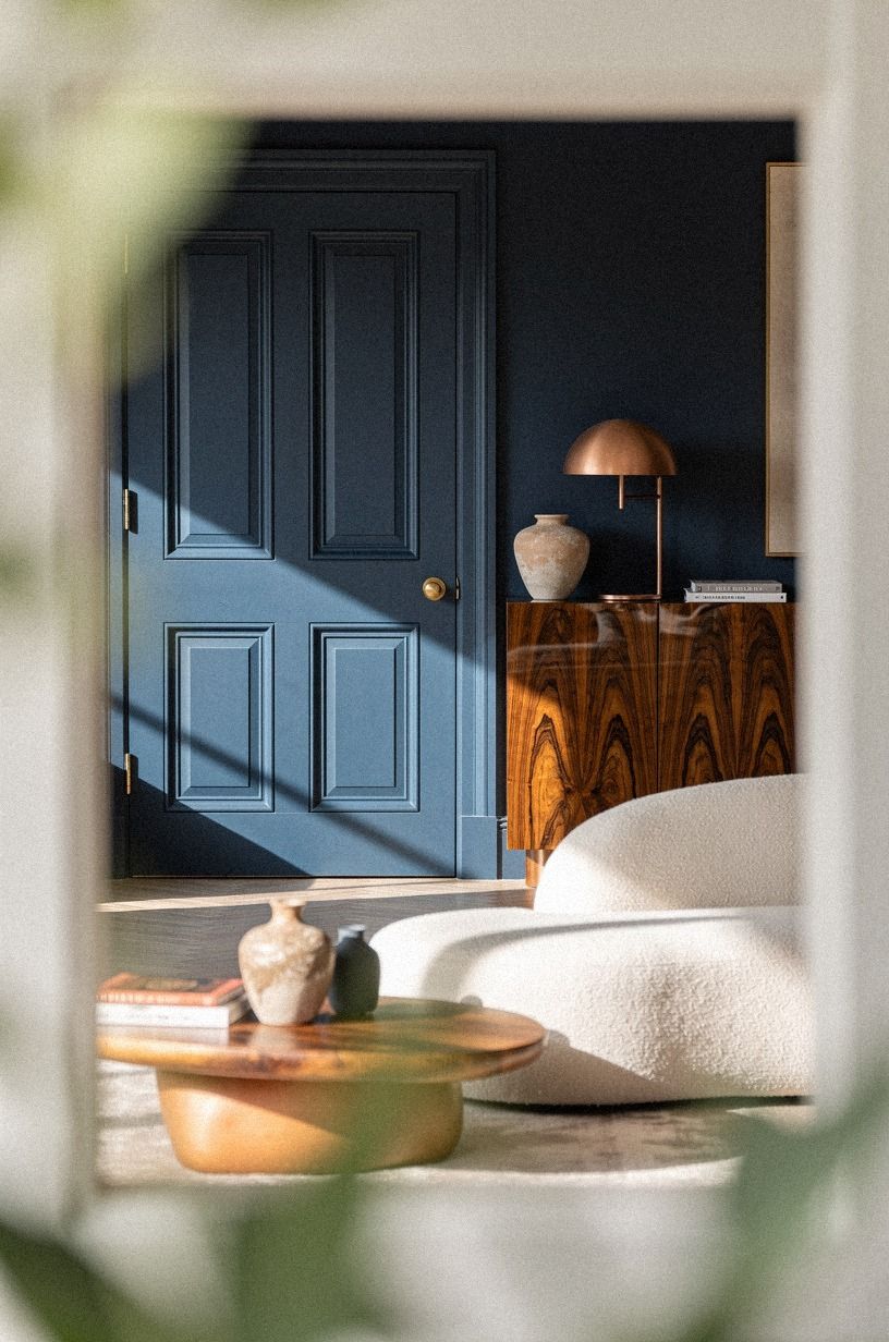 the Farrow & Ball Hague Blue move (paint the door bold, on purpose)