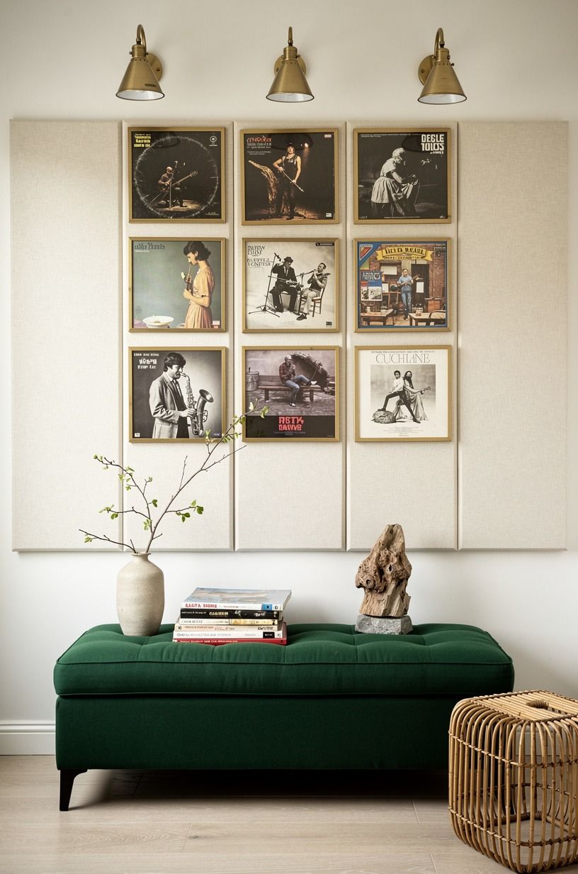 Layer acoustic panels behind framed album art