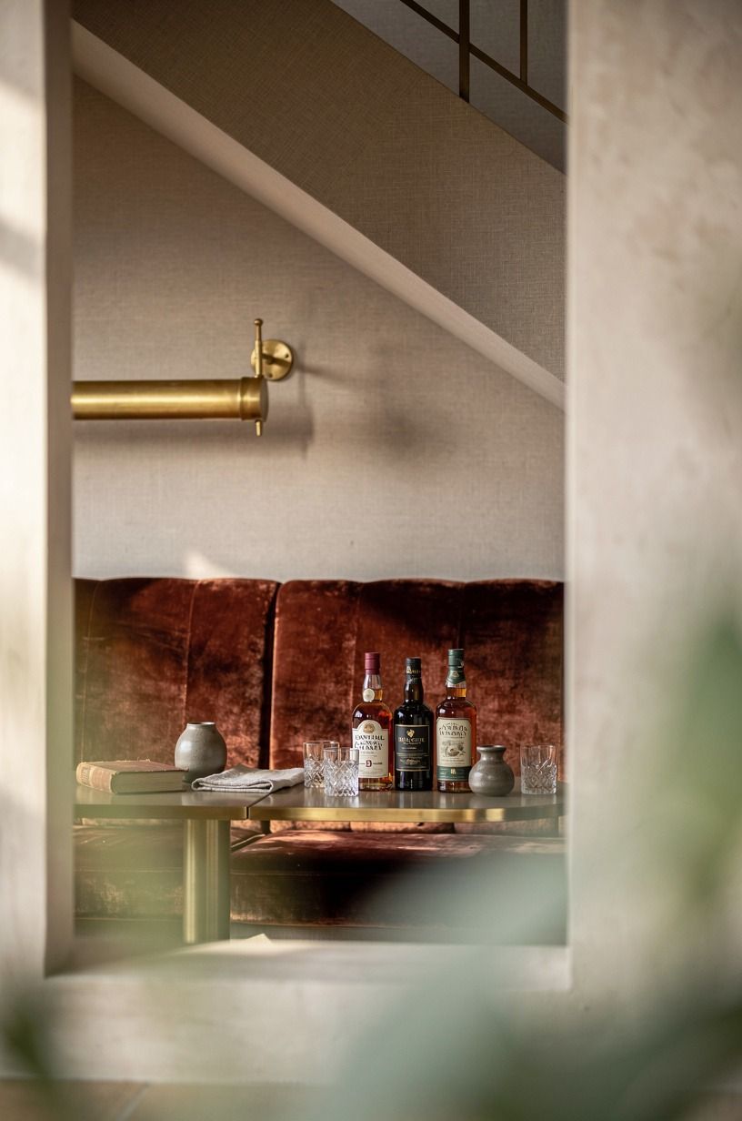 Create a hidden tasting nook under stairs