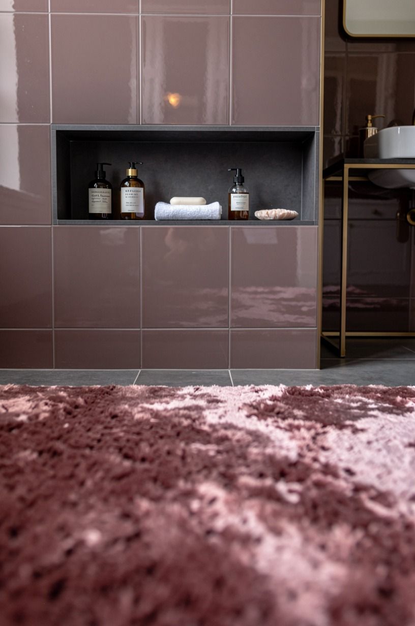 Contrast glossy walls with a matte soap niche
