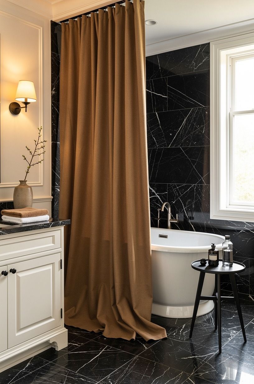 Hang a full-length curtain where you expect a shower curtain