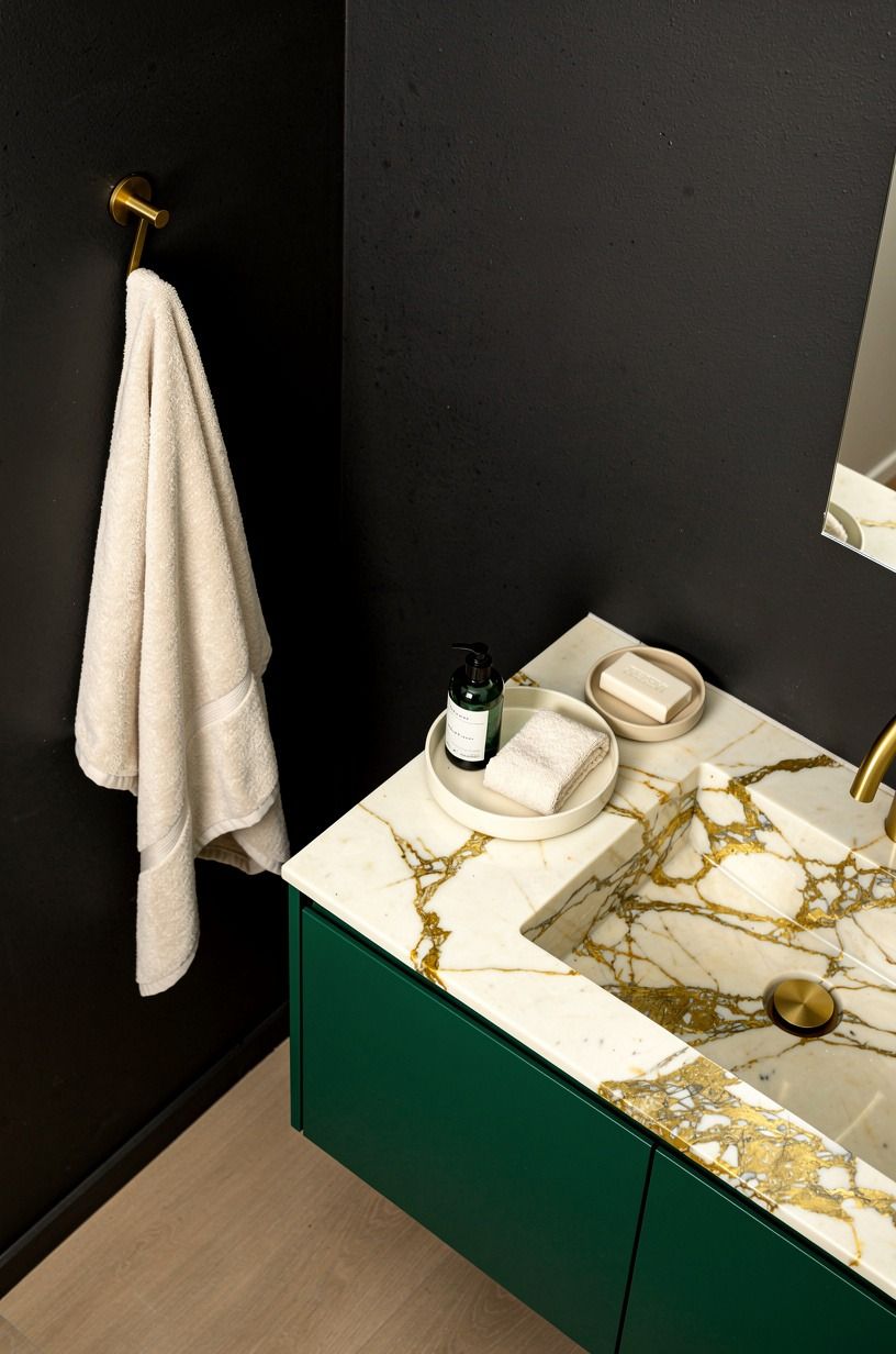Keep one black wall matte and quiet