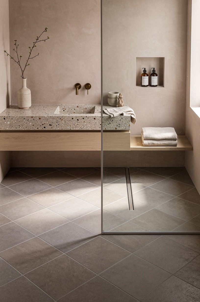 Lay large-format warm gray tiles on a diagonal