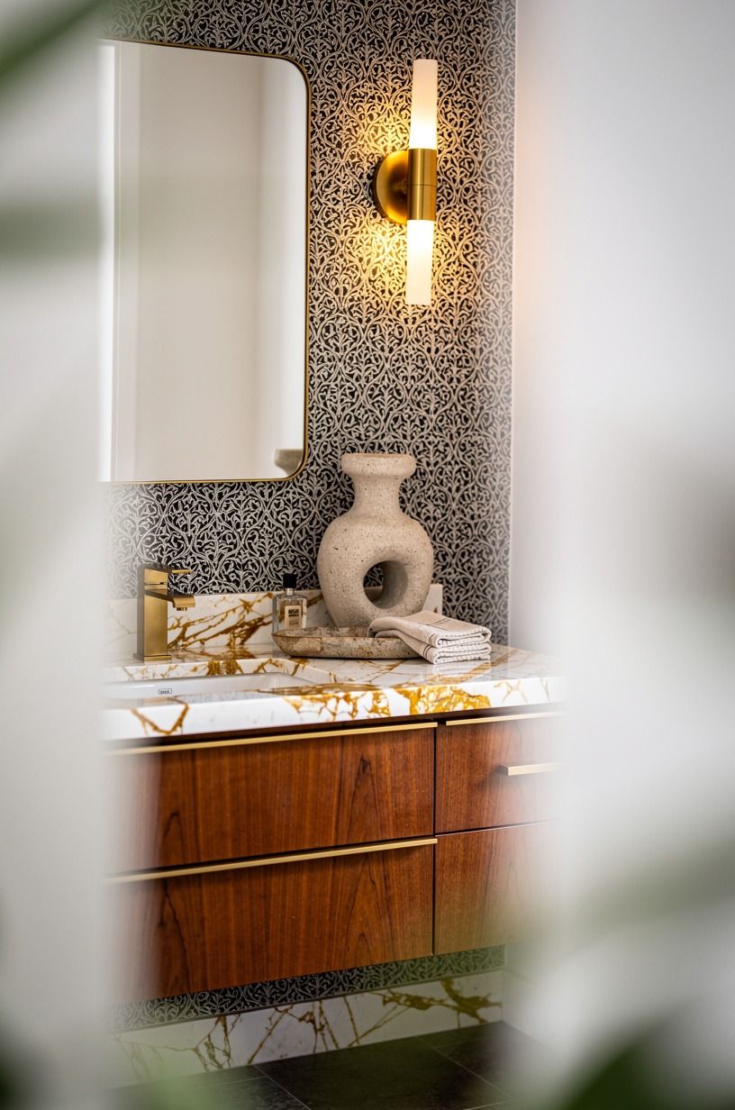 Let the Vanity Wall Carry the Pattern (powder room vanity wallpaper)