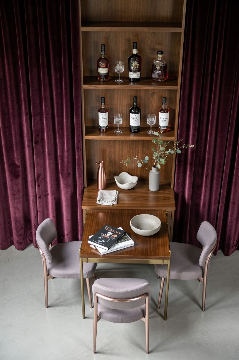 Frame the shelf with curtains, not more cabinetry