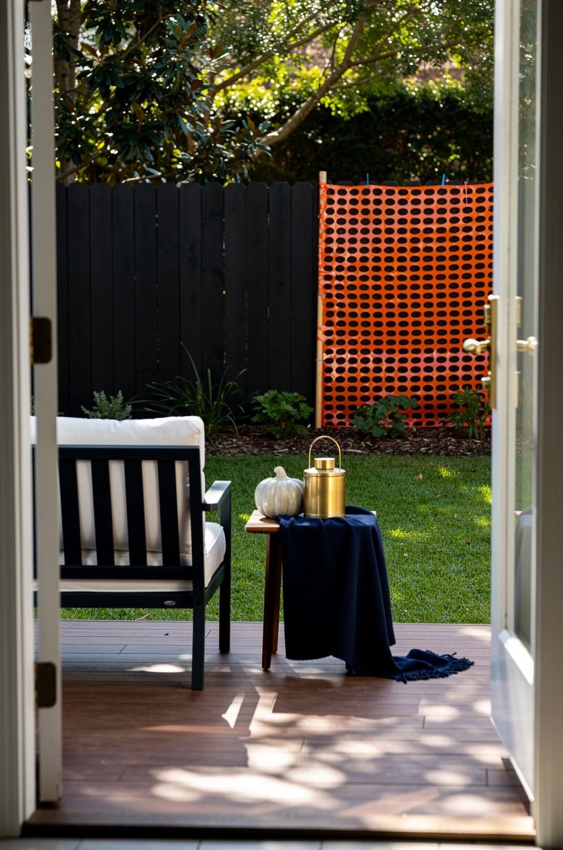 Is Black Paint Better Than Orange Plastic for a Halloween Fence Line?
