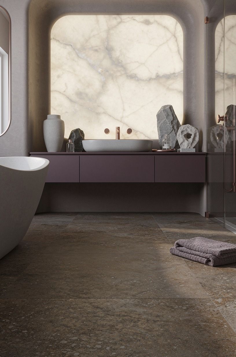 Anchor the floor with earthy, slip-aware surfaces