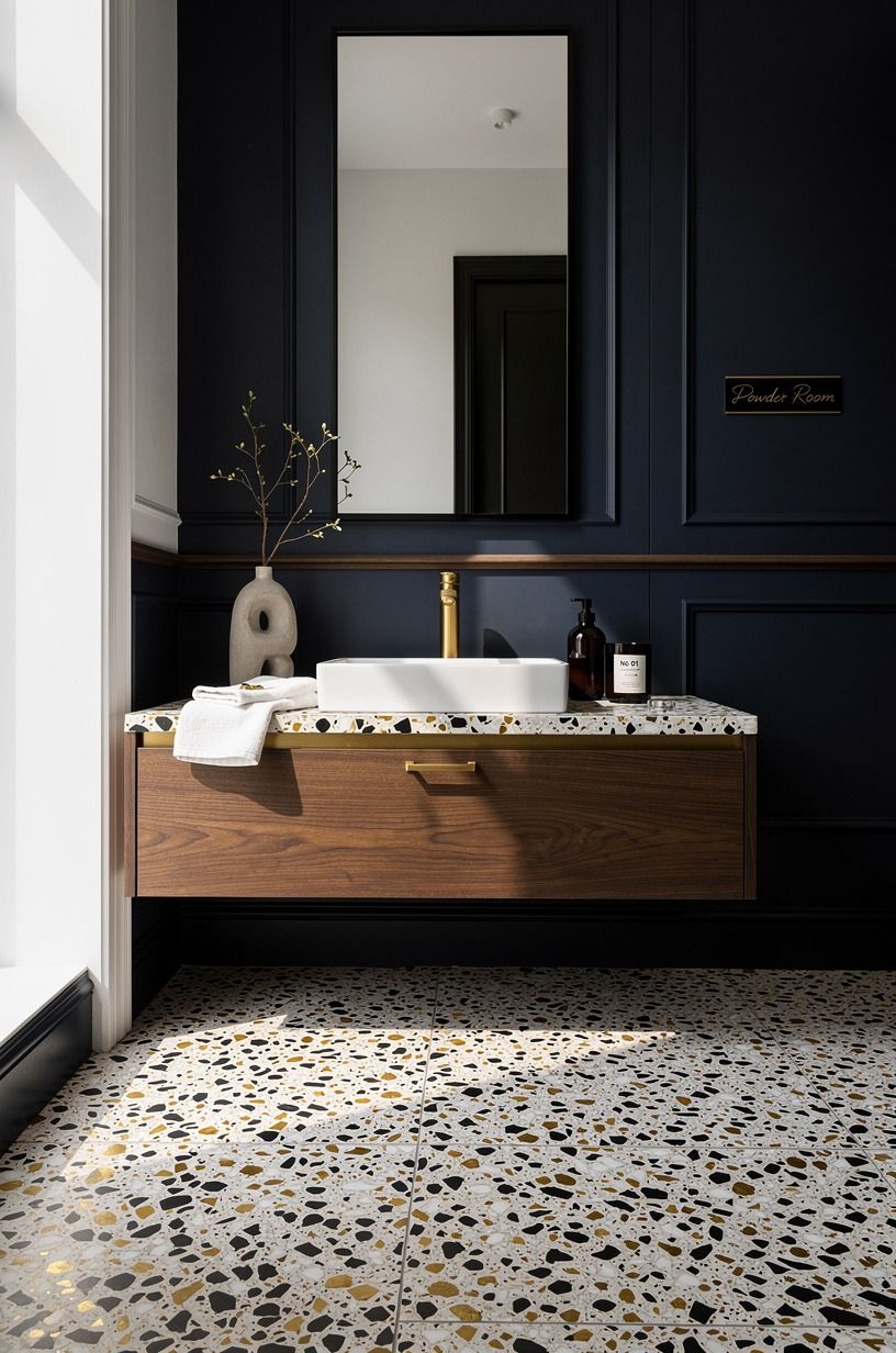 Choose Warm Metal Over Cold Chrome in a Black and Gold Powder Room
