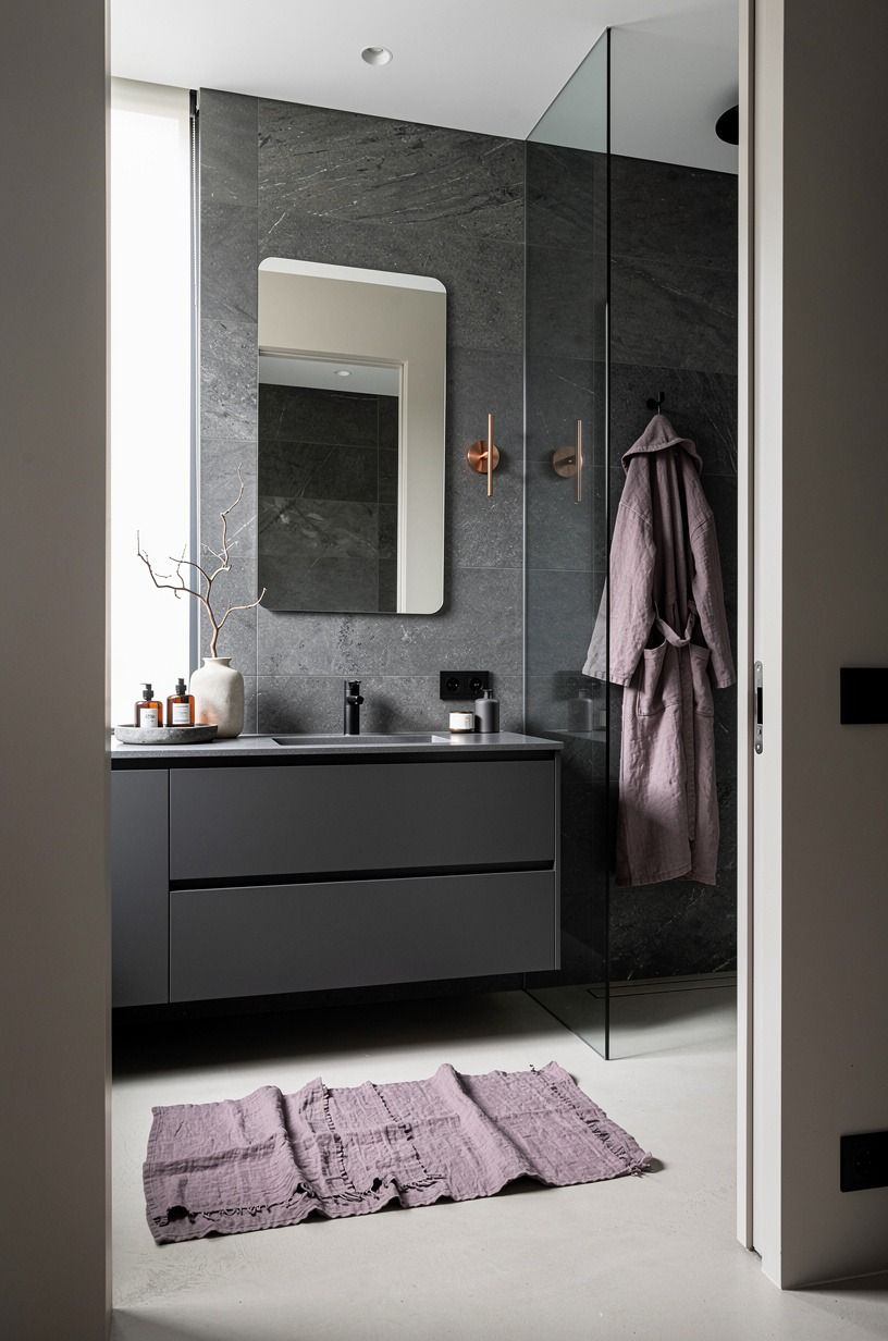 Put texture before pattern in a black grey bathroom