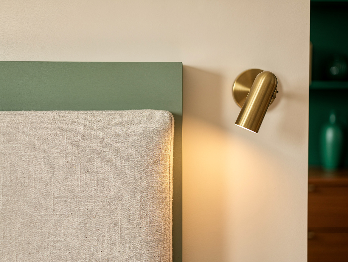 Close detail of clean matte sage paint edge meeting warm ivory wall above a text